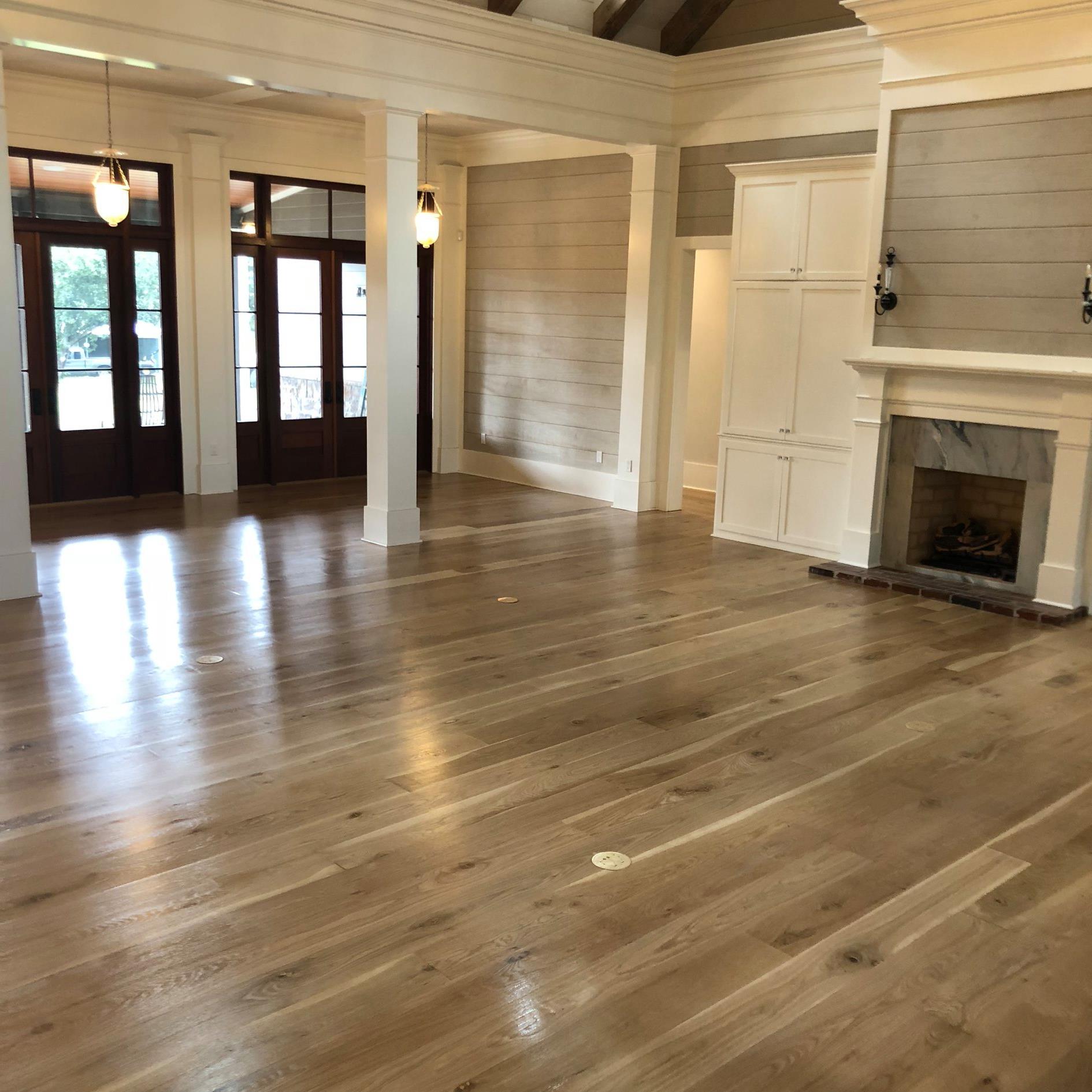 Reclaimed White Oak flooring — smooth face, waterproof and thermally modified, installed over concrete with radiant heat