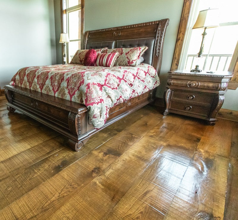 Bedroom with reclaimed White Oak dirty top flooring — waterproof, thermally modified hardwood with radiant heat system