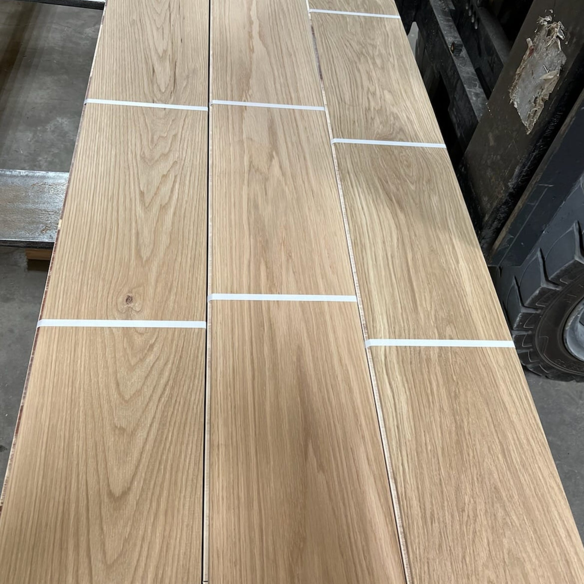 Waterproof White Oak flooring — 100% real solid wood for concrete slabs, bathrooms, radiant heat, and high-traffic areas. Thermally modified with heat and steam