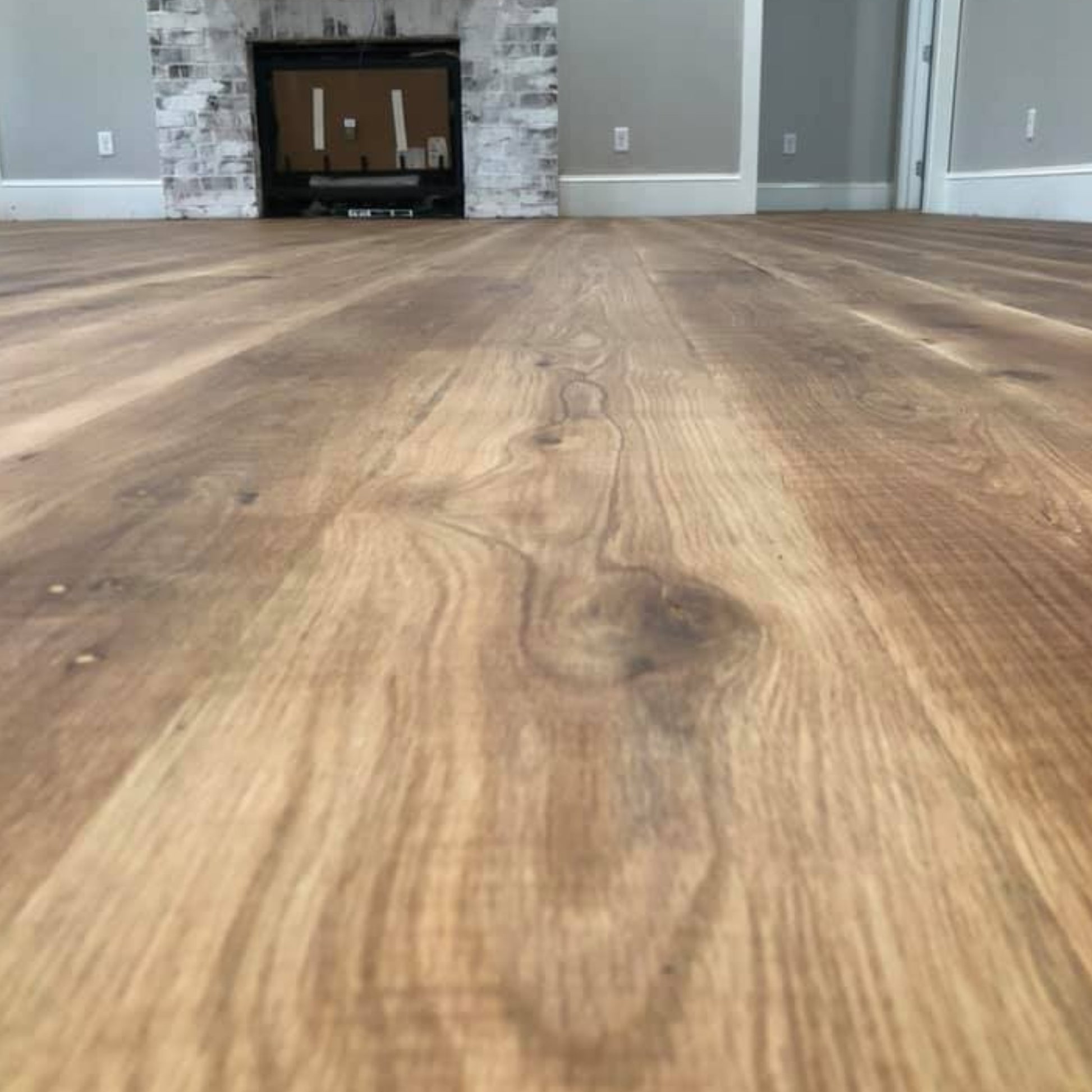 Waterproof White Oak flooring — 100% real solid wood for concrete slabs, bathrooms, radiant heat, and high-traffic areas. Thermally modified with heat and steam
