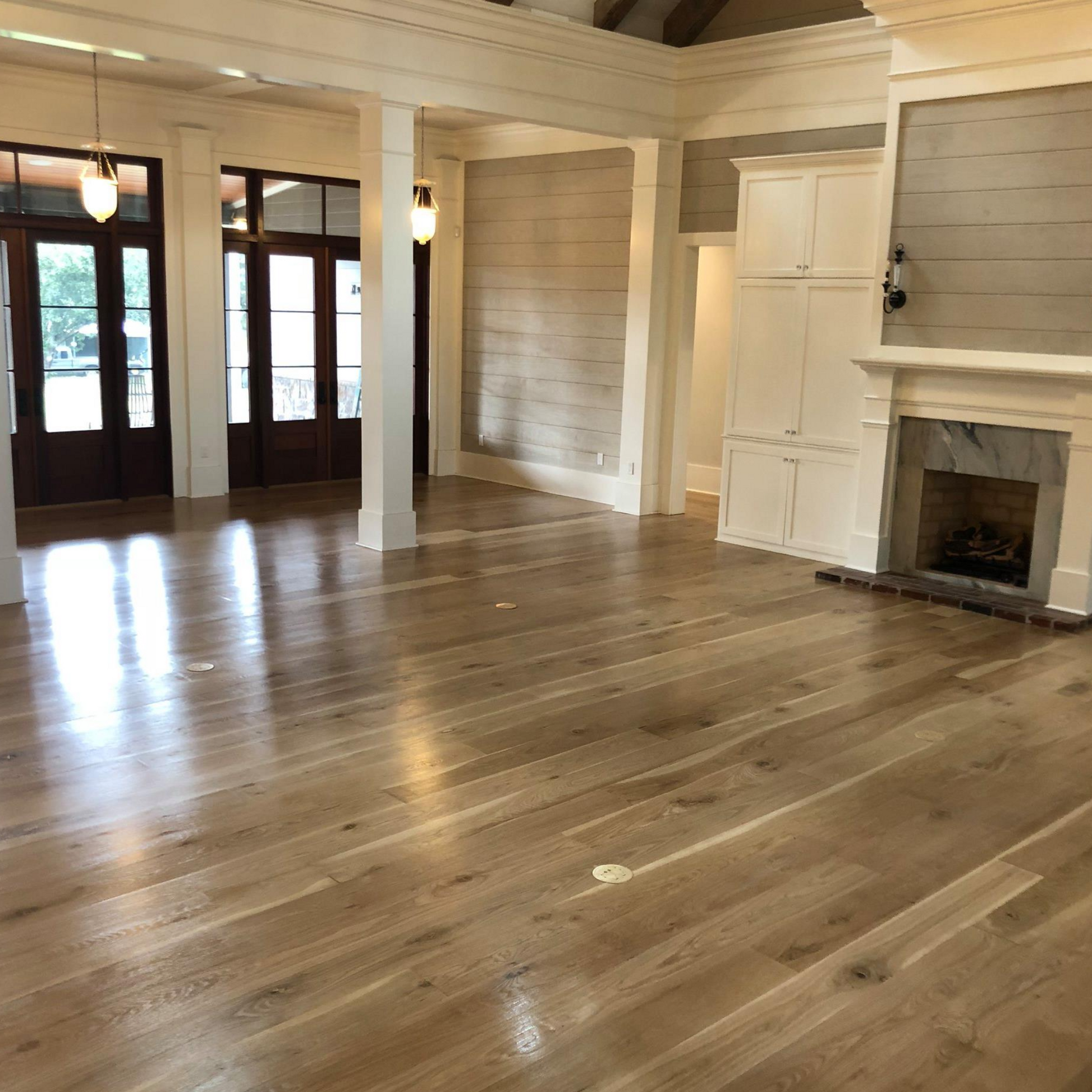 Waterproof White Oak flooring — 100% real solid wood for concrete slabs, bathrooms, radiant heat, and high-traffic areas. Thermally modified with heat and steam