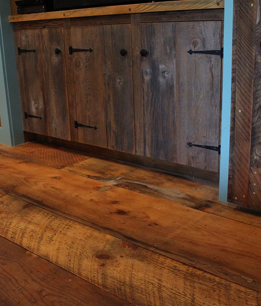 Close-up of thermally modified reclaimed White Oak flooring — dirty top with circular saw marks and skip-planed surface