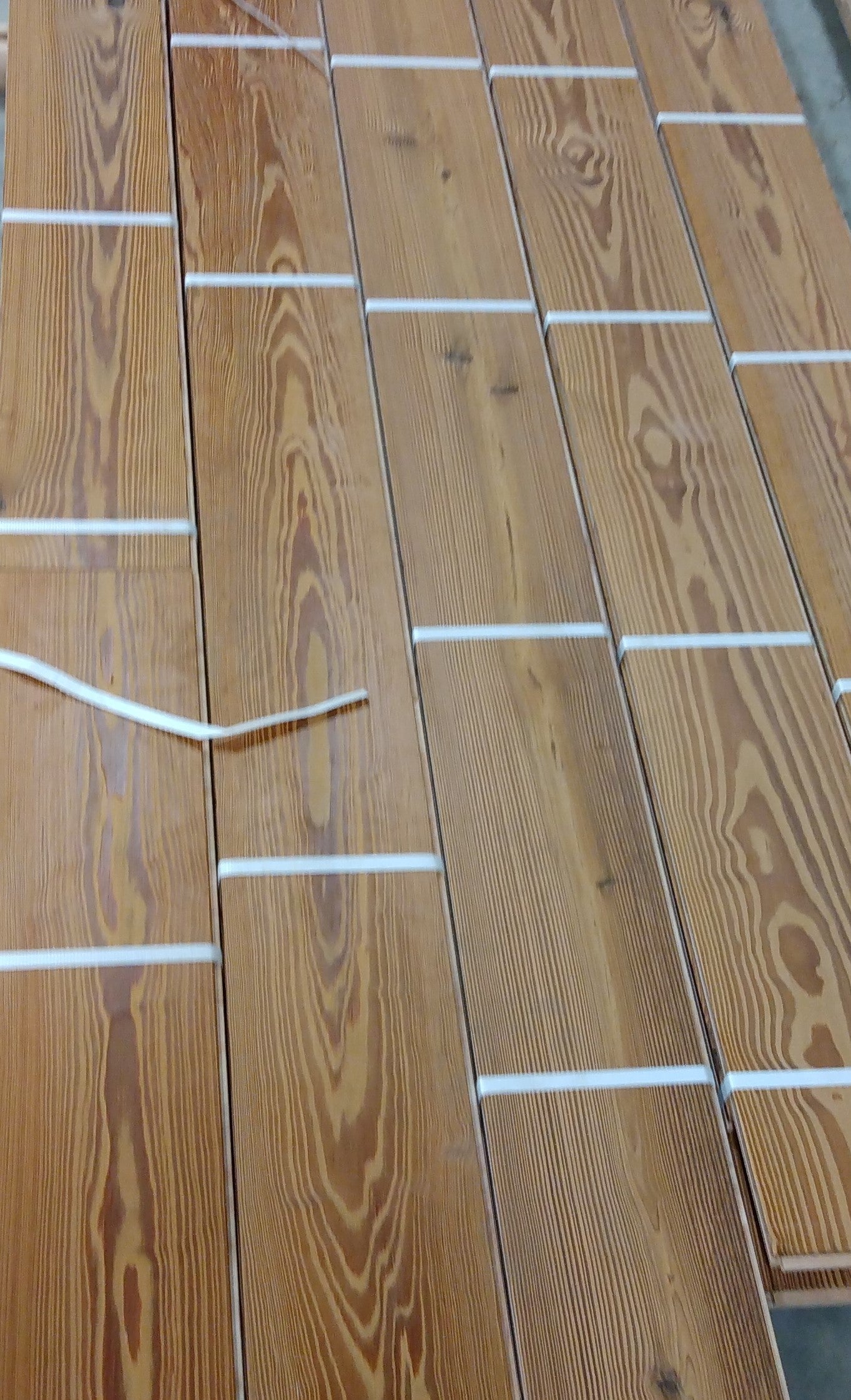 Close-up of Antique Heart Pine deck board — solid 3/4”, thermally modified, waterproof and termite proof